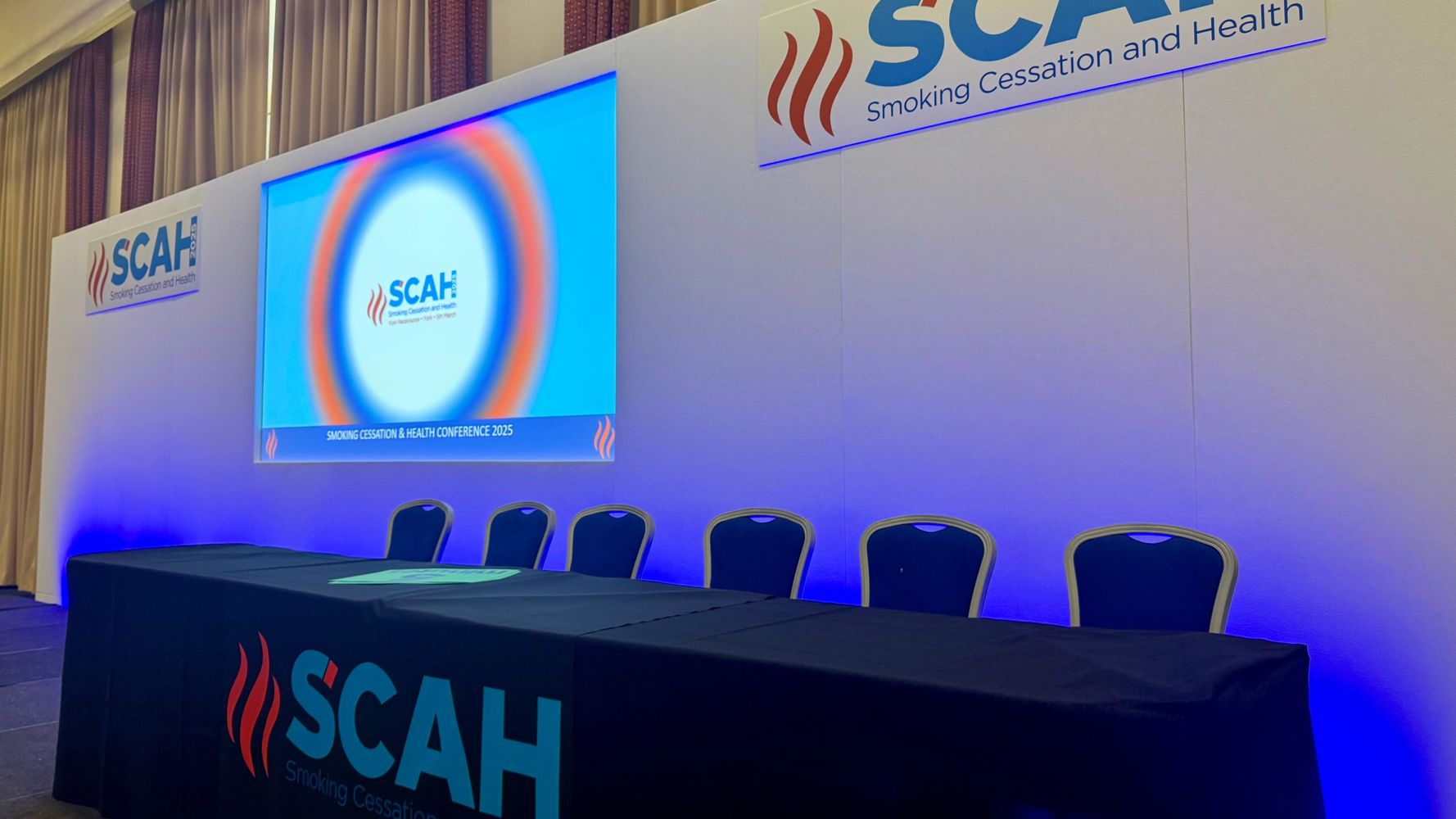 Empty panel setup for the Smoking Cessation and Health Conference 2025.