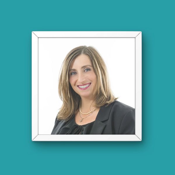 Portrait of Cathy Cahill in white frame