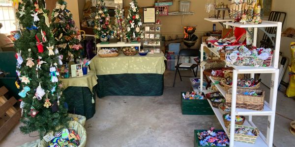 A room with decorated Christmas trees and ornaments 