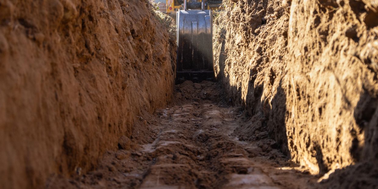 Bucket in trench being dug