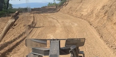 Tractor improving dirt road