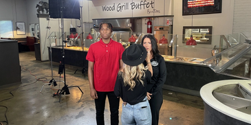 George Creative | behind-the-scenes photo of NIL athlete on Wood Grill Buffet shoot