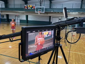 George Creative | CAMMATE JIB filming female basketball player during a sports commercial shoot.