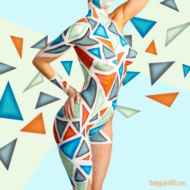 Woman with colorful geometric body paint.