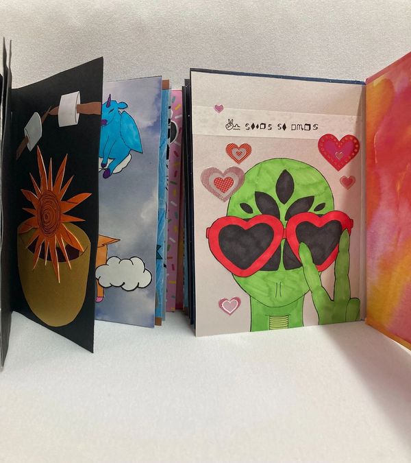 Inside of an open book, showing several surreal illustrations.