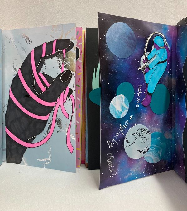 Inside shot of a book, showing several surreal illustrations