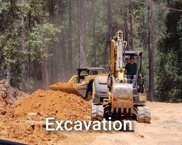 Excavation work with heavy machinery in a forested area.