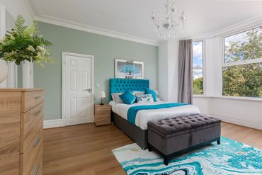 Spacious master bedroom, ensuite, with a stunning Newsham Park view. 