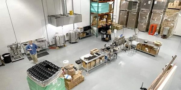 Organized bottling facility with stainless steel equipment and modern production line
