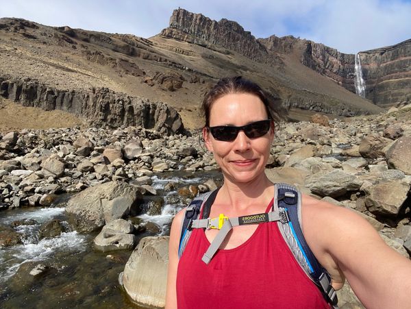 Jennifer infront of a waterfall in Iceland. 