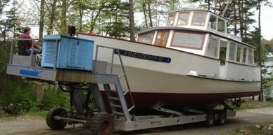 Carpentry, paint, and fiberglass on a G. Guptill 44