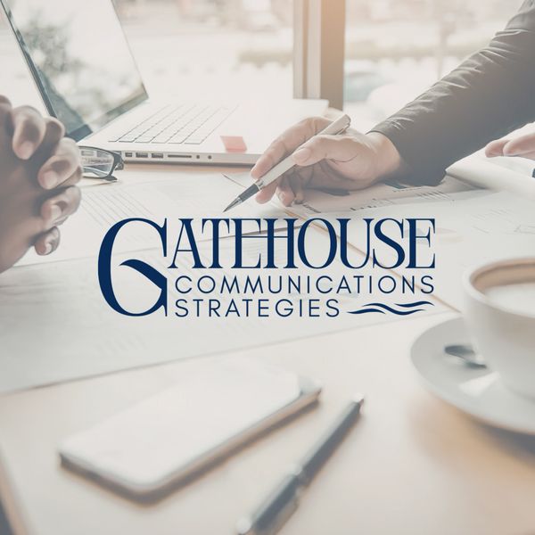 Business meeting with Gatehouse Communications Strategies logo overlay.