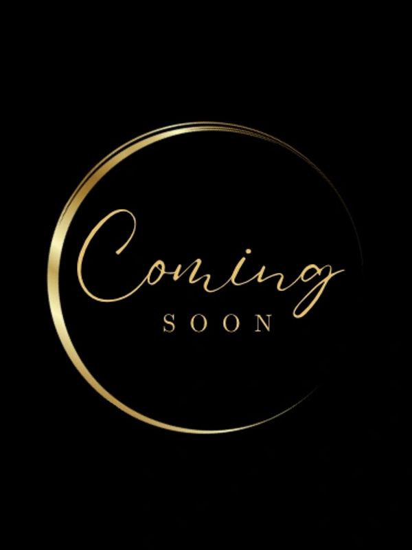 Elegant golden 'Coming Soon' text on a black background.