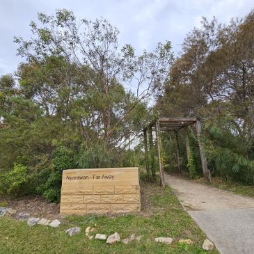 Entry to Nyarruwan - Far Away trail surrounded by greenery.