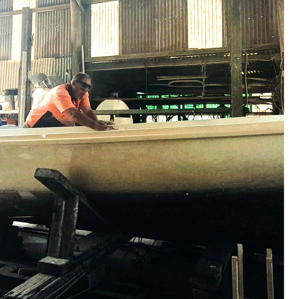 Justin working on a timber boat