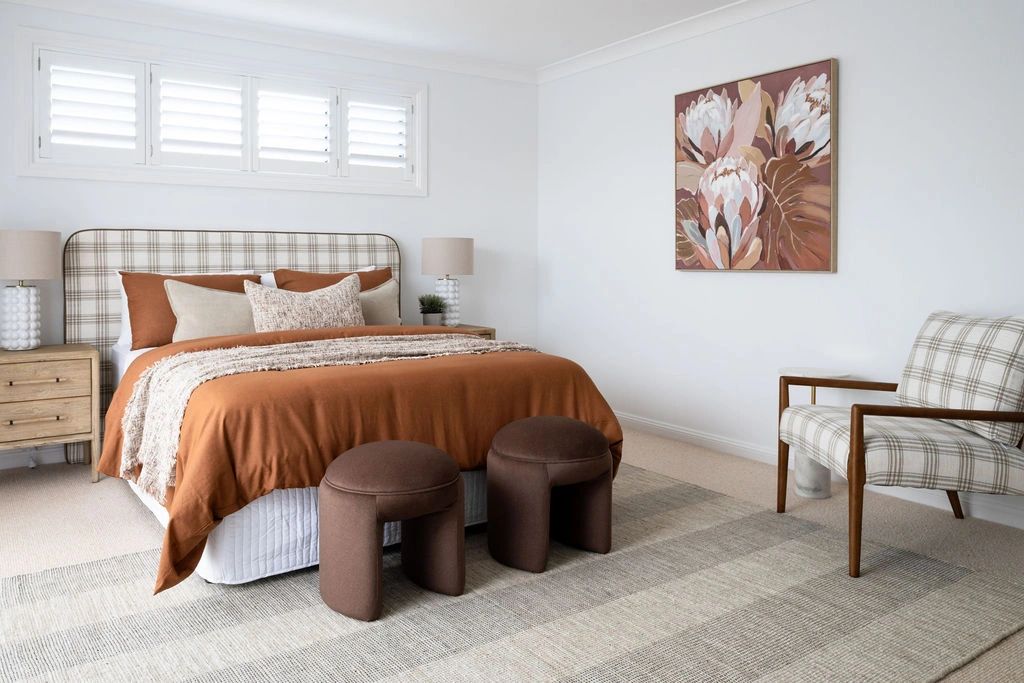 Modern bedroom with warm brown and beige tones.