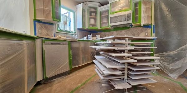 A kitchen prepped for cabinet painting
