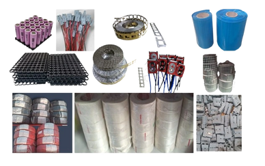 Assorted electronic components and materials including batteries, wires, coils, and tapes.