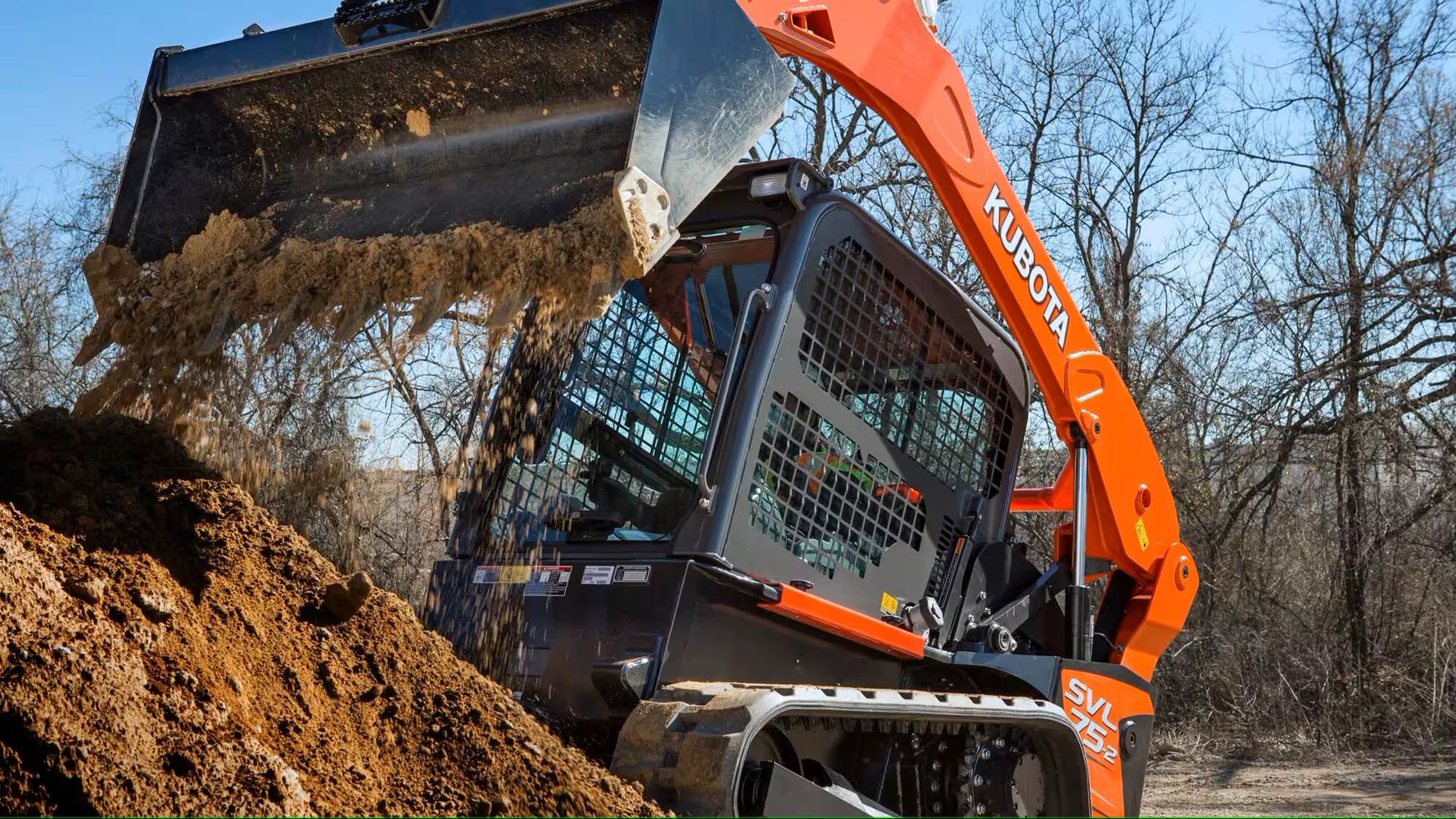 a bulldozer working in sand
