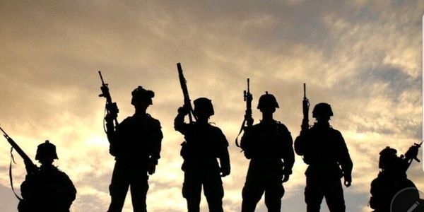 Silhouette of military personnel