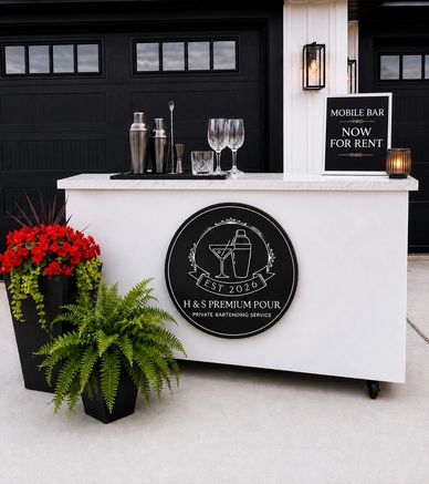 Mobile bar setup with bartending tools and rental sign outdoors.