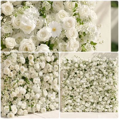 Elegant white floral arrangements with roses and daisies.