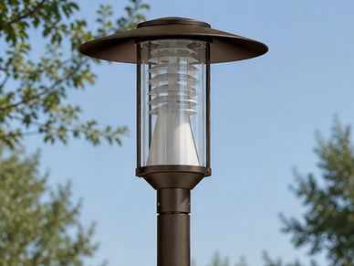 A modern outdoor lamp post under clear skies.