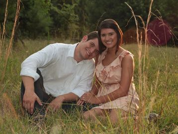 Engagement photoshoot in a field