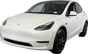 White Tesla Model Y electric SUV with black wheels.