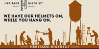 Workers installing a water tower in Heritage District.