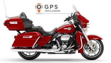 Red touring motorcycle with GPS included for navigation.