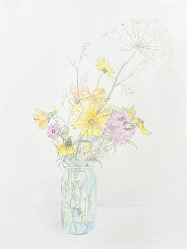 Delicate wildflowers in a glass jar with soft pastel hues.