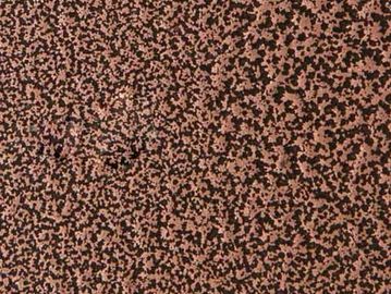 Close-up of a granite surface with black and pink speckles.