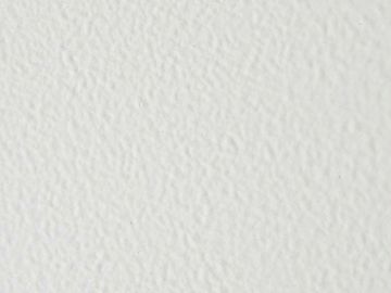 Close-up of a textured white surface with subtle shadows.