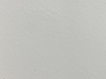 A plain white textured surface with subtle imperfections.