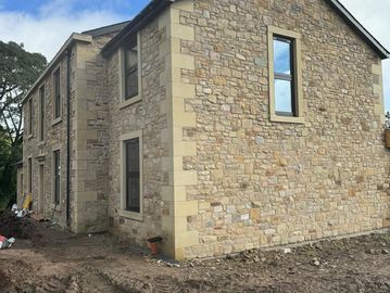 Double storey random stonework extension
