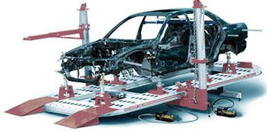 Car body frame mounted on a vehicle frame straightening machine.