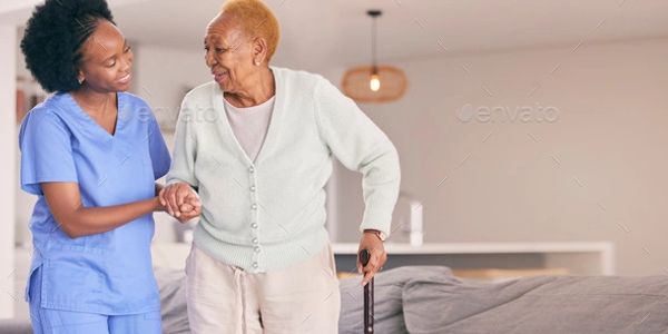 A nurse assisting an elderly woman with a walking cane at home.