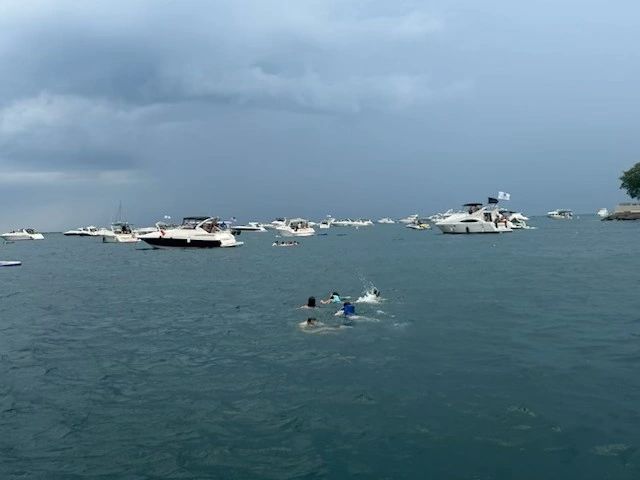 Swimmers (including 2 young children) in the PlayPen dangerously far from their vessel/photo courtesy of Ted Widen boater safety boat safe chicago water safety chicago playpen playpen chicago