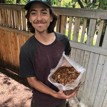 Tylor Berreth shows the mycelium as he prepares to install a mushroom garden.