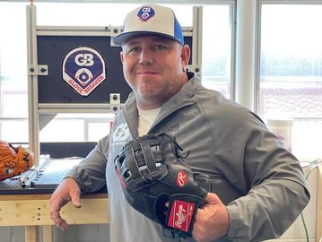 GloveBreaker founder holding a baseball glove, showing expert Glove Break In Service.