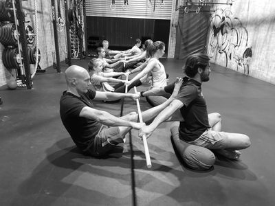 Members stretching during class