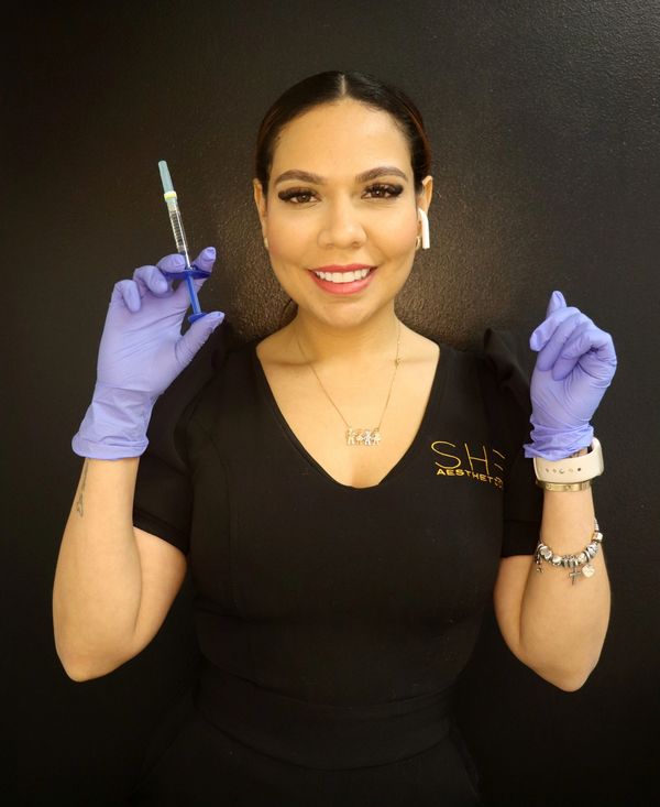 Dr Dayana A smiling while getting ready for injection of toxins or fillers! 