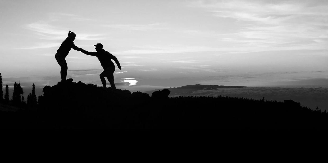 Helping hand on hill