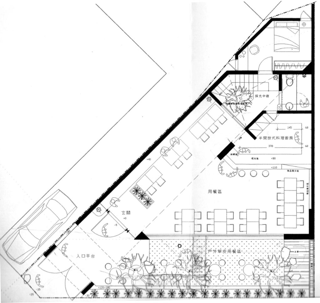 Architectural floor plan of a dining area with outdoor seating and a parking space.