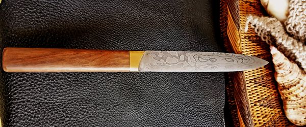 Hand forged layered damascus knife with a hidden tang