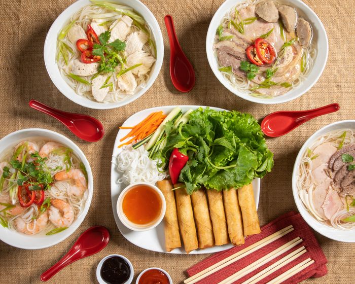 Pho rice noodle soup and crispy egg rolls