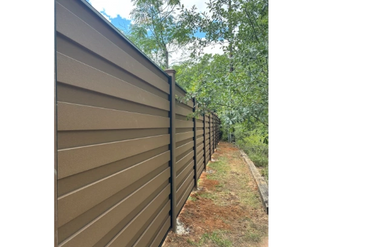 Contemporary dark wood fence 