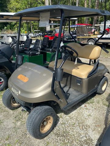 Champagne colored E-Z-Go golf cart