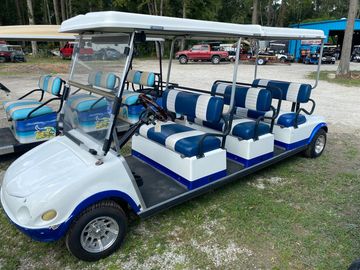 White Club Car golf cart with blue trim